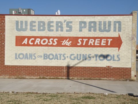 This sign on the side of the wall is all that is left of Weber's. At Magnolia and S. Main.